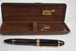 A Montblanc Meisterstruck 149 plunger fill fountain pen in black, boxed, and in good condition
