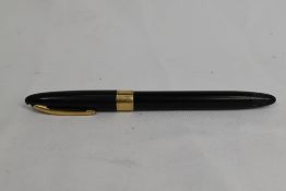 A Sheaffer Statesman Snorkel fill fountain pen in black with broad band to the cap having Sheaffer