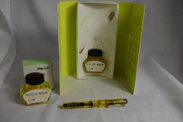 A Pelikan M205 Duo piston fill fountain pen in transparant yellow with Pelikan BB nib. In original