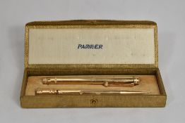 A boxed Parker Jack Knife Safety button fill fountain pen and propelling pencil set in gold fill