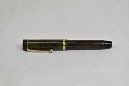 A Parker Duofold Jr Lucky Curve button fill fountain pen in Jade green with single band to Flat