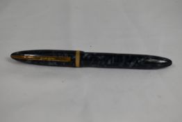 A Mentmore Paramount lever fill fountain pen in grey marble with knerled broad band to cap having
