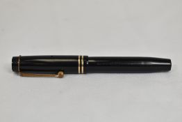 A Parker Duofold Jr Streamlined button fill in black with two bands to the cap having Parker Duofold