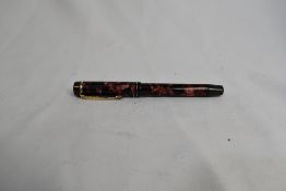 A De La Rue Onoto the pen 6233 plunger fill fountain pen in red marble with two narrow bands to
