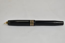 A Parker Duofold Lady Deluxe burron fill in black with three bands and ring to the cap having Parker