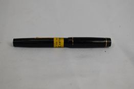 A Croxley lever fill fountain pen in black with single narrow band to cap having Dickenson nib.