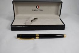 A boxed Sheaffer 300 converter fountain pen and ballpoint pen set in black having Sheaffer nib. In