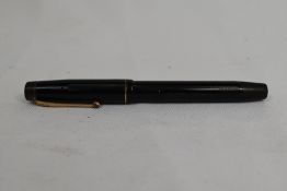 A De la Rue Onoto the Pen 5601 plunger fill fountain pen in black with engine turned decal and