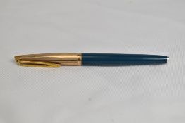 A Waterman CF converter fountain pen in teal with a rolled gold cap having 14ct nib. In very good
