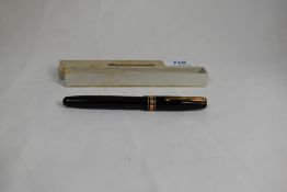 A boxed Waterman W5 lever fill fountain pen in black with broad band and two narrow bands to the cap