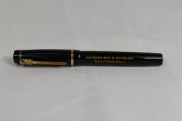 A Croxley 'The Croxley Pen' lever fill fountain pen in black with single band to cap having