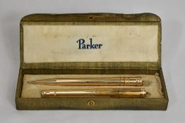A boxed Parker Jack Knife Safety button fill fountain pen and propelling pencil set in gold fill