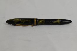 A Sheaffer Balance Lifetime lever fill fountain pen in green/black marble with single band and white