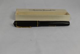 A boxed Conway Stewart 286 lever fill fountain pen in black with a narrow bands to the cap having