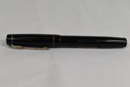 A Croxley 'The Croxley Pen' lever fill fountain pen in black with single band to cap having