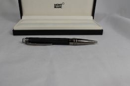 A Monteblanc FL Starwalker rollerball in black. As new in original box with service book and