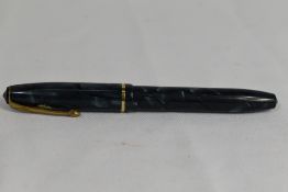 A Conway Stewart 15 lever fill fountain pen in blue black marble with single band to the cap