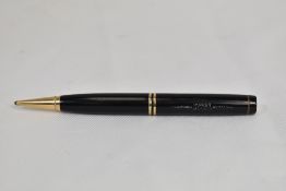A Parker Duofold propelling pencil in black with two bands. In good condition