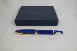 A Recife Mystique cartridge/ converter fountain pen in blue swirl with broad gold band having Recife