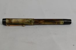 A rare De la Rue Onoto the Pen plunger fill fountain pen in translucent gold/brown with single
