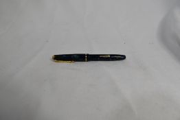 A boxed Conway Stewart Dinkie 540 leverfill fountain pen in green black marble having a Conway