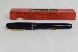 A boxed Mabie Todd & Co Swan lever fill 3220 fountain pen in blue with two narrow bands to the cap