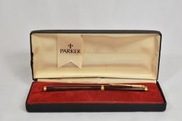 A boxed Parker 75 aerofill fountain pen in brown lacque. In excellent condition