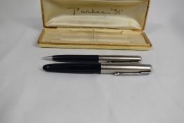 A boxed Parker 51 demi vacu fill fountain pen and propelling pencil set in black with lustiloy
