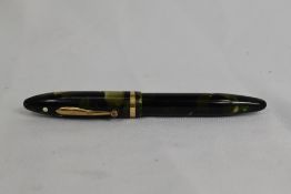 A Sheaffer Balance Snr lever fill fountain pen in green/black marble with single band and white spot