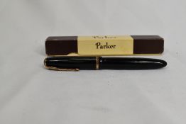 A Parker Duofold fountain pen in black with decorative band to cap having Duofold N nib in