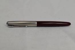 A Parker 51 aeromatic fill fountain pen in burgundy with lustiloy cap. Approx 13.8cm in very good