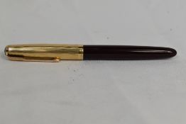 A Parker 51 aeromatic fill fountain pen in burgundy with gold filled cap. Approx 13.9cm in very good