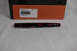 A Tibaldi Infrangible catridge/converter fountain pen in mauve/red having Tibaldi B nib. In original