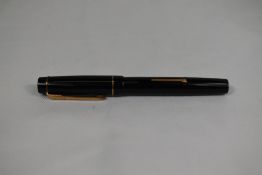 A Croxley 'The Croxley Pen' lever fill fountain pen in black with single band to cap having