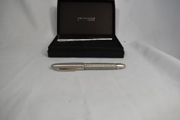 A Faber- Castell piston fill fountain pen known as 'the Porche P3100'. Designed by Porche and made