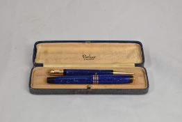 A boxed Parker Duofold Lady button fill fountain pen and propelling pencil in lapis blue with