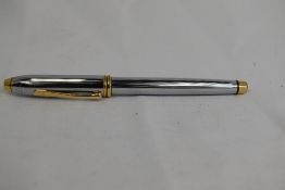 A Cross Townsend converter fountain pen in chrome and gold having Cross nib. Approx 14.9cm very good