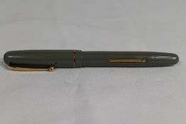 A Mabie Todd Swan 3130 lever fill fountain pen in grey with single band to cap having Swan 1 nib. In