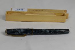 A boxed Chatsworth lever fill fountain pen in grey marble with single narrow band to the cap