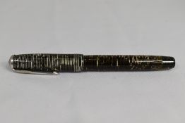 A Parker Vacumatic plunger fill fountain pen in black and grey with three narrow bands to the cap