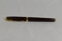 A Parker 75 converter fountain pen in thuya brown having Parker gold nib. Approx 12.8cm in very good