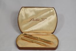 A boxed Parker 51 Insignia aerofill fountain pen and propelling pencil set gold filled. In excellent