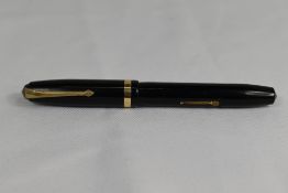 A Conway Stewart 84 lever fill fountain pen in black with single broad band to the cap having Conway