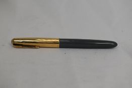 A Parker 51 vacu fill fountain pen in grey with gold filled cap having diamond to gold clip.