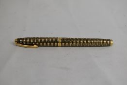 A Sheaffer Imperial Sovereign cartridge fountain pen in Gold Fill diamond design with white spot,