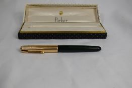 A boxed Parker 51 aeromatic fill fountain pen in forest green with gold filled cap. Approx 13.7cm