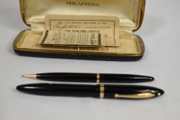 A Sheaffer Balance Lifetime lever fill fountain pen and propelling pencil set in black with single