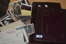 Two Albums and a collection of loose of GB & World Postcards including Military, Humour, Real