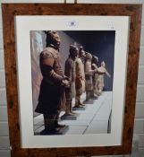 A modern photographic print of the terracotta soldiers, within a plain mount, modern wood effect