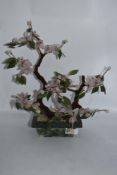 An oriental study of a cherry tree using natural stones and beadwork.